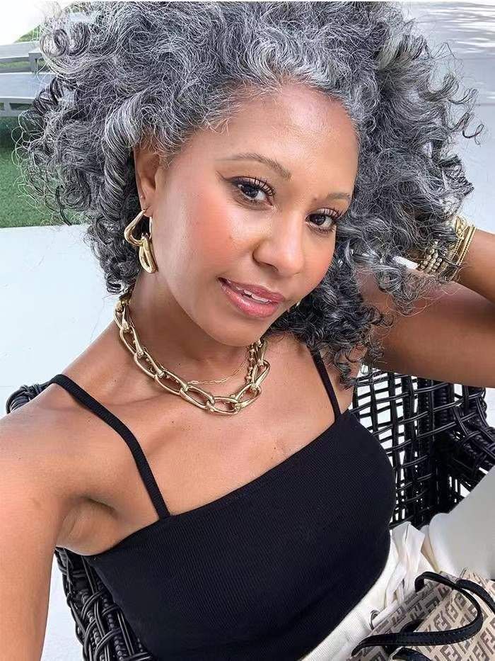 Hot ponytail puff bun updo hairstyle for growing out grey hair with highlights salt and pepper Hot ponytail puff bun updo hairstyle for growing out grey hair with highlights salt and pepper