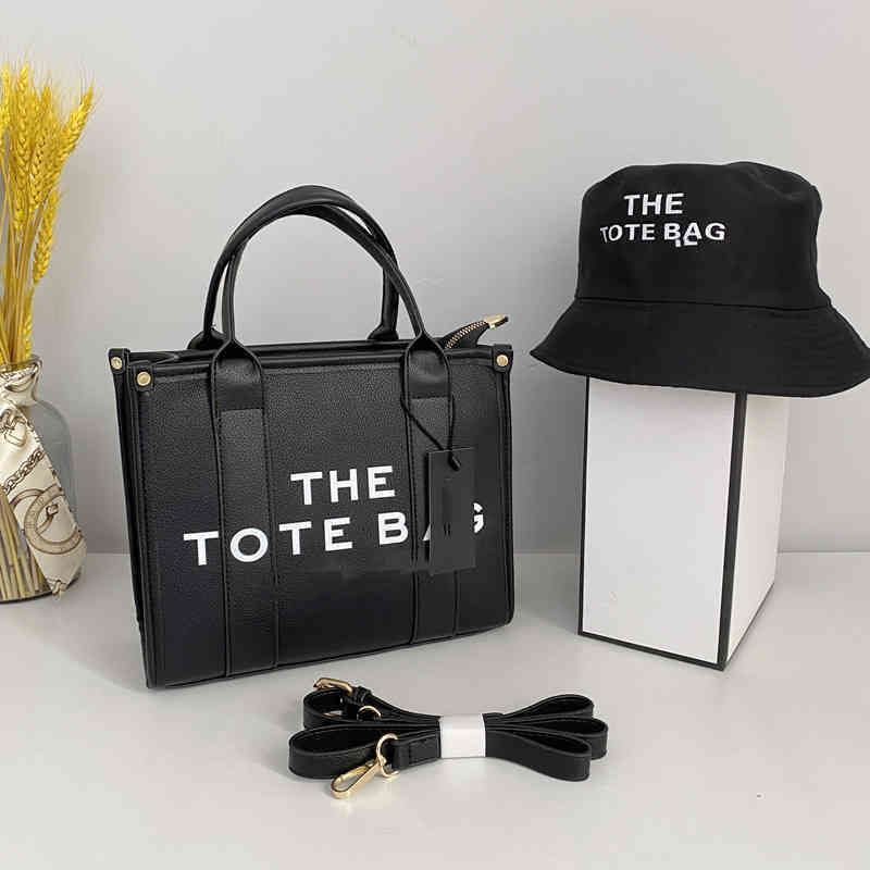 schwarzer Anzug: Tasche + Hut