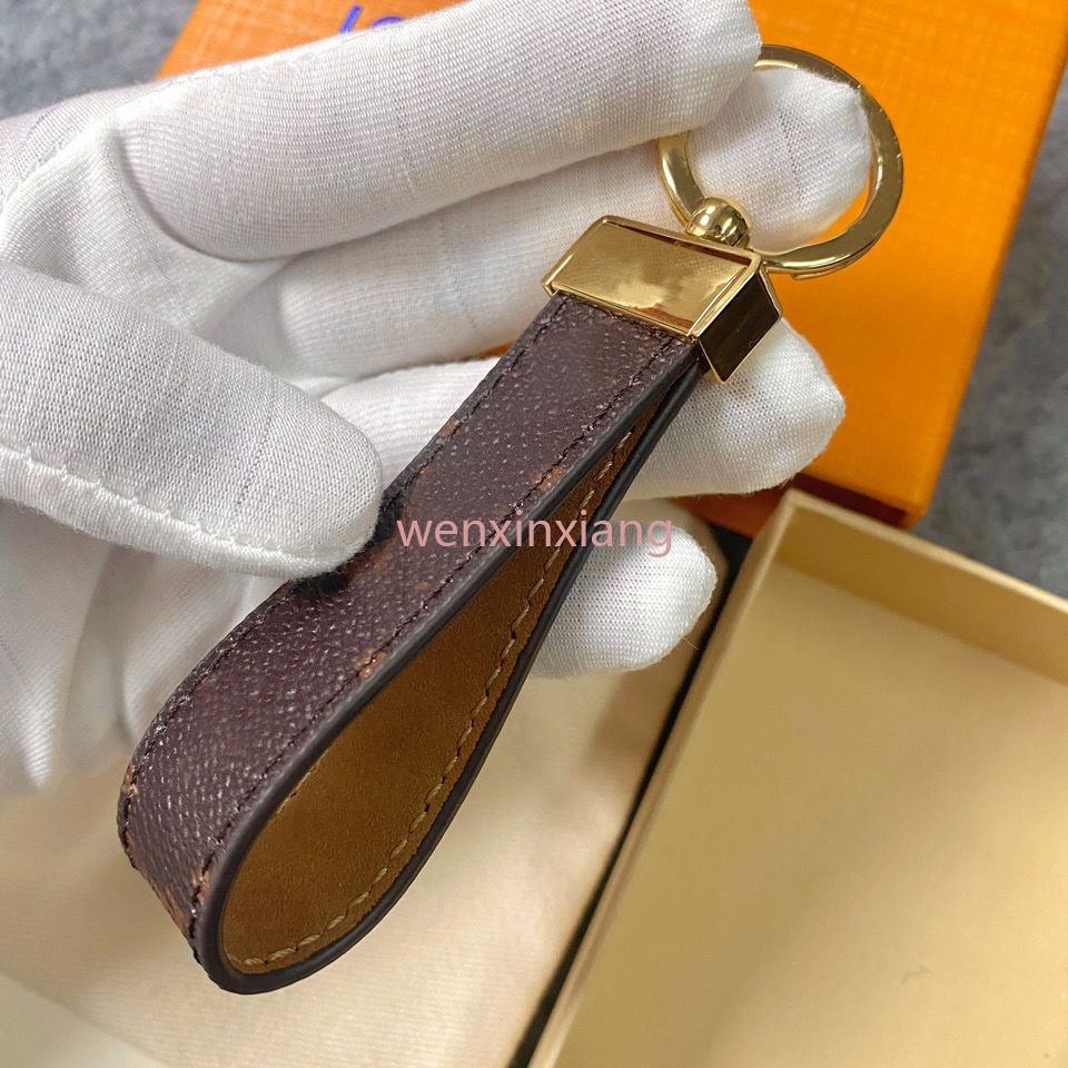 Aesthetic keys and key chain with Louis Vuitton key pouch, puff ball, and  jeweled initial.