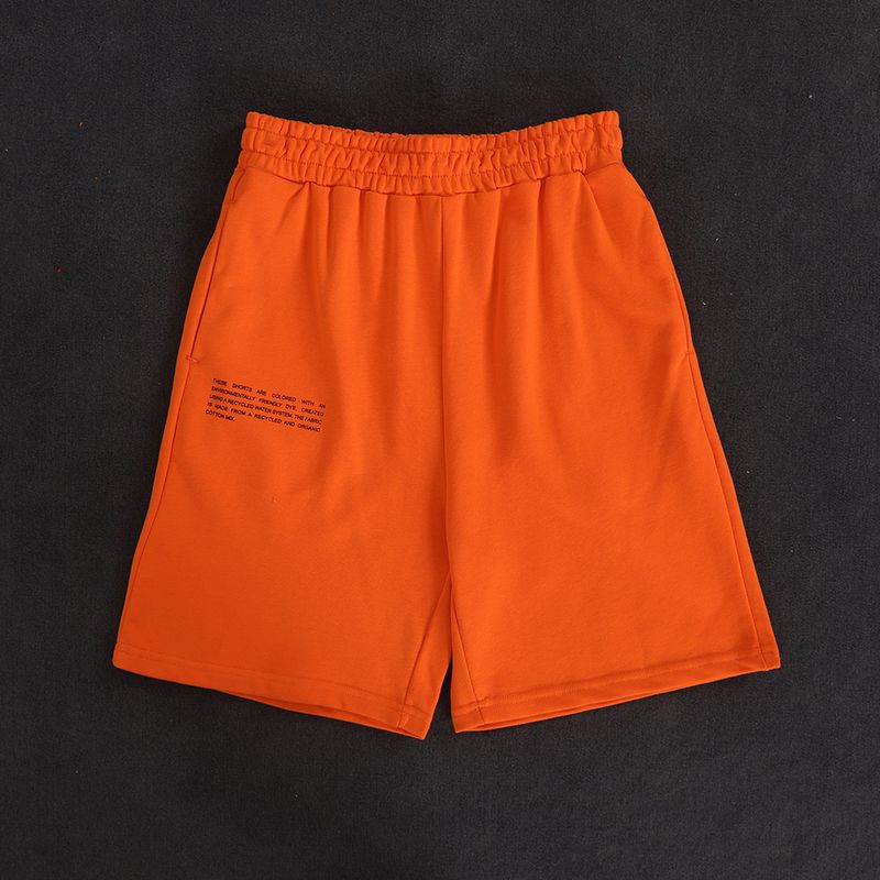 Orange långa shorts