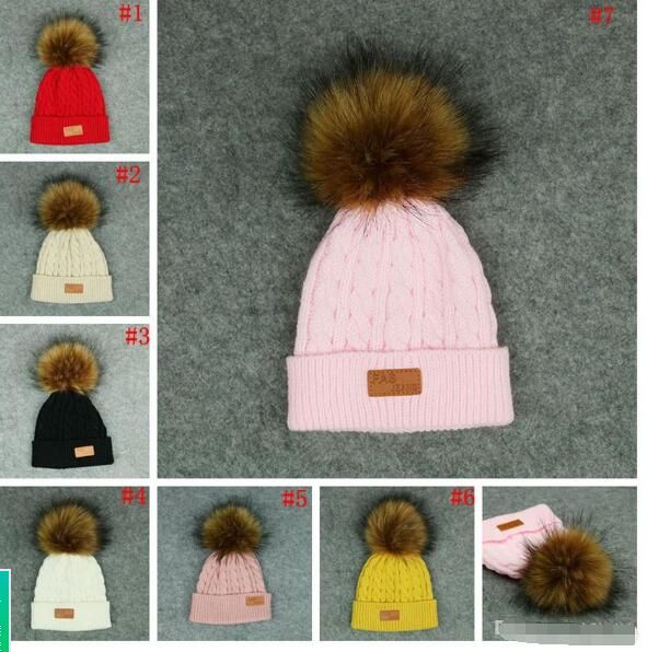 fitted hat with fur ball