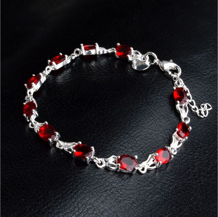 Sterling Silver bracelet with Ruby charms