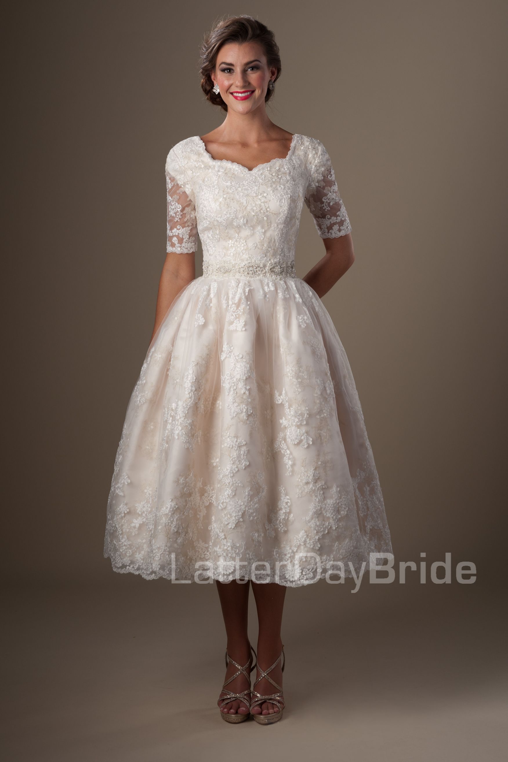 tea length white dress with sleeves