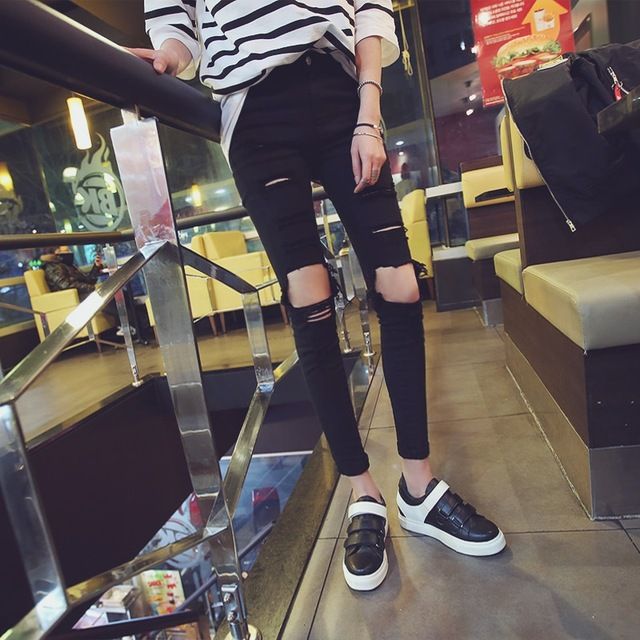 black jeans with big holes