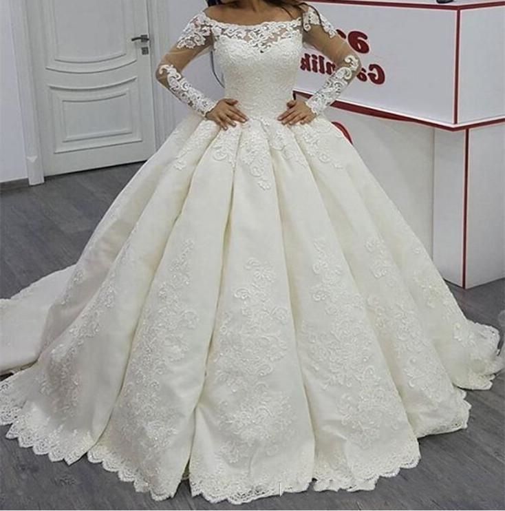 Compra Vestido De Bola De Satén Vintage Vestidos De Novia 2021 Ilusión De  Manga Larga Vestido Blanco Cuello Barco Hinchado Satinado Marfil Apliques  Ver A Través Del Vestido Nupcial Barato | Entrega