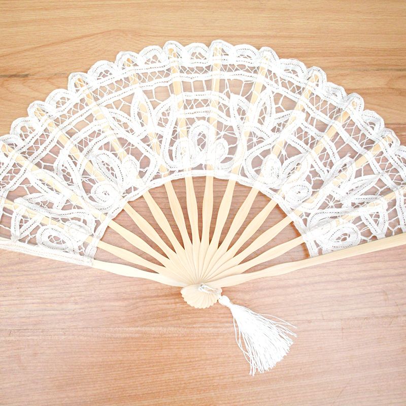 white hand held fans