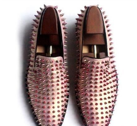white loafers with gold spikes