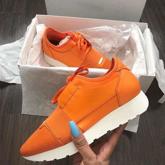 orange designer sneakers
