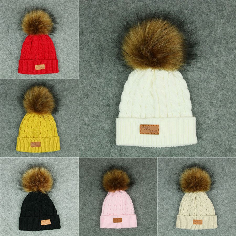 sports winter hats with ball on top