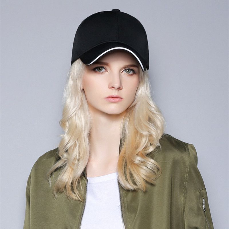 women with baseball caps