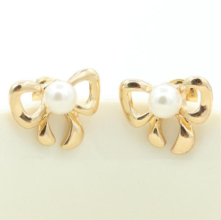 gold bow earrings studs