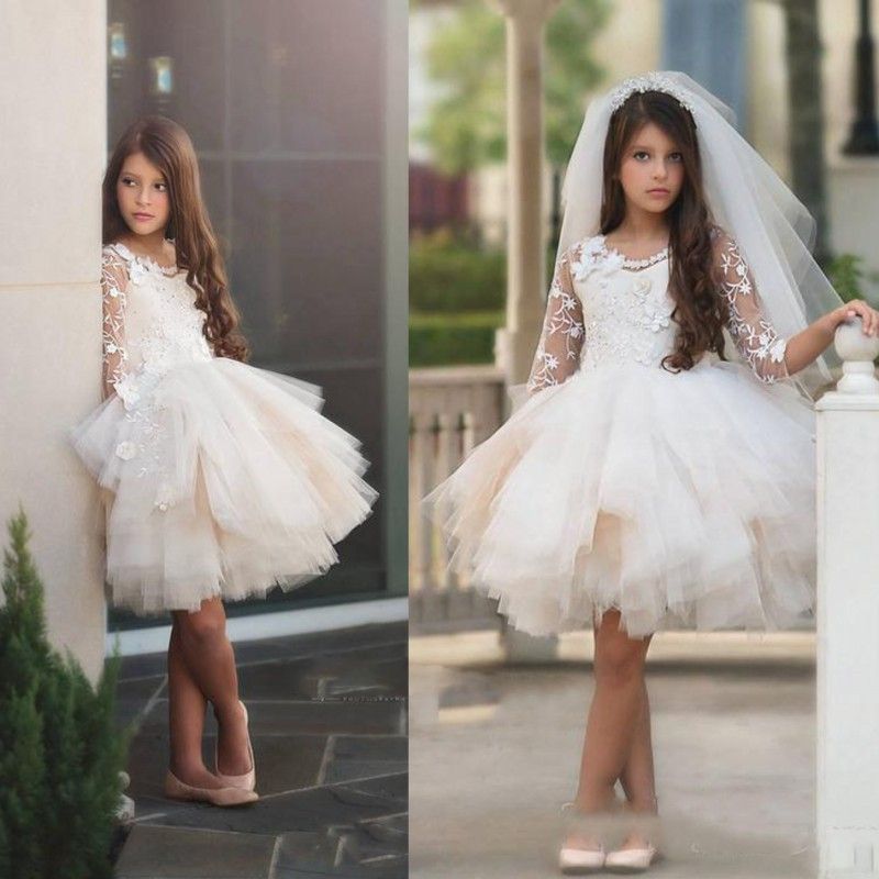 Compra Longitud De La Rodilla Vestidos De Niña De Flores 2018 Mangas Largas  Transparentes Con Apliques De Encaje Vestidos Para Niñas Vestidos De  Desfile Vestido De Novia En Tul Mini Vestido De