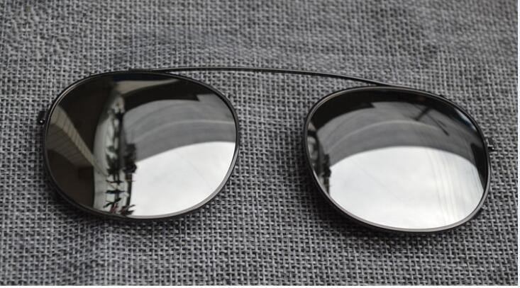 Black frame silver mercury lens