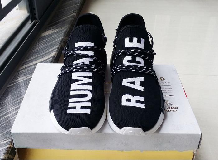Human race shoes on sale black and white