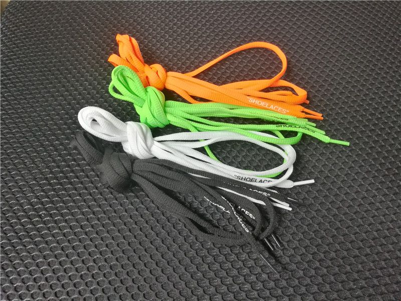 green and orange shoelaces