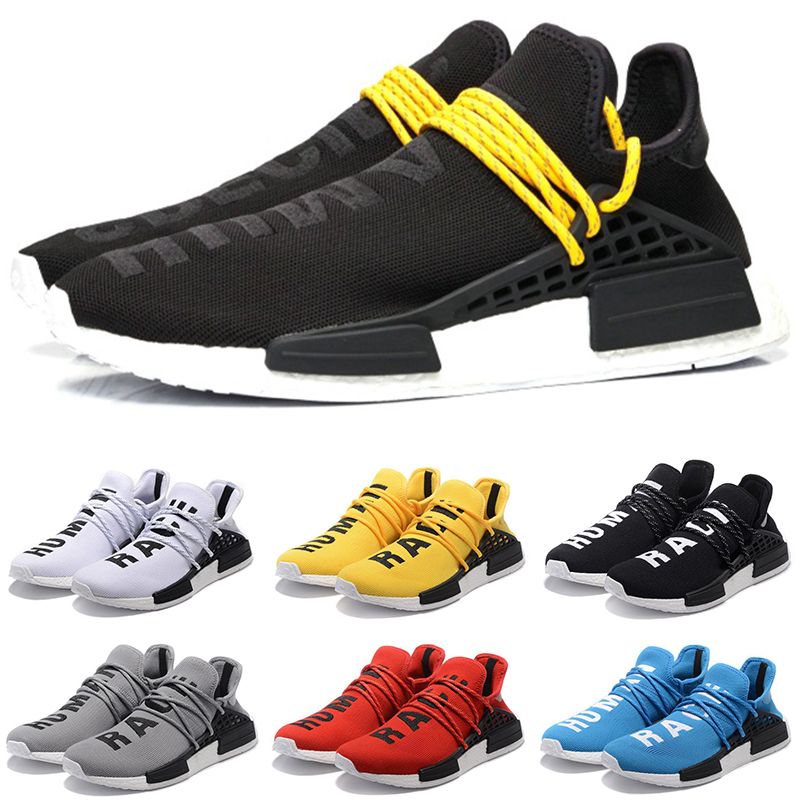yellow and black human race sneakers