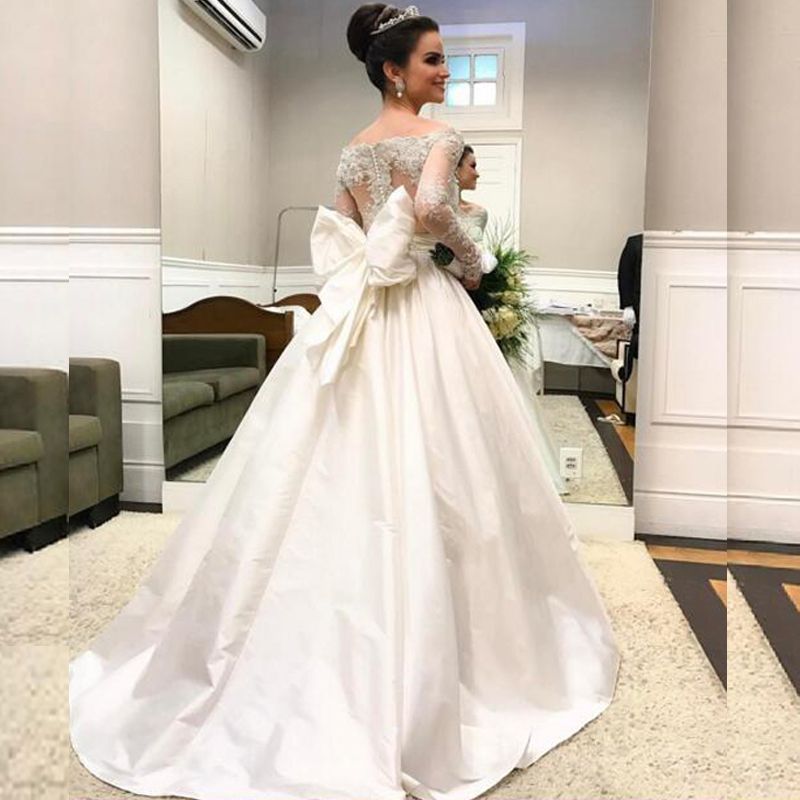 Acquistare Abiti Da Sposa A Maniche Lunghe Arabi Collo A Spalle Scoperte In  Rilievo Con Applicazioni Di Pizzo In Rilievo Illusion Back Taffetà Abiti Da  Sposa Con Fiocco Oversize Economico | Consegna