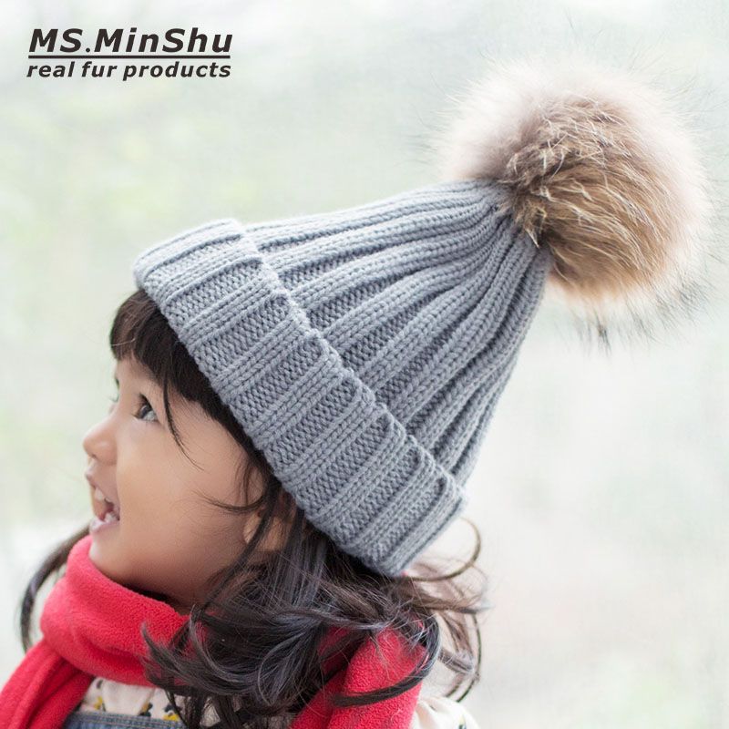 cap with fur ball on top
