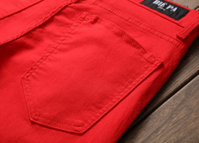 red ripped pants