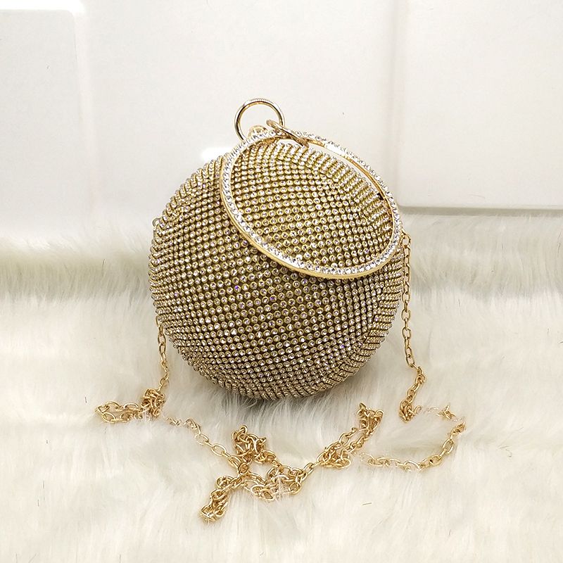 round gold clutch bag