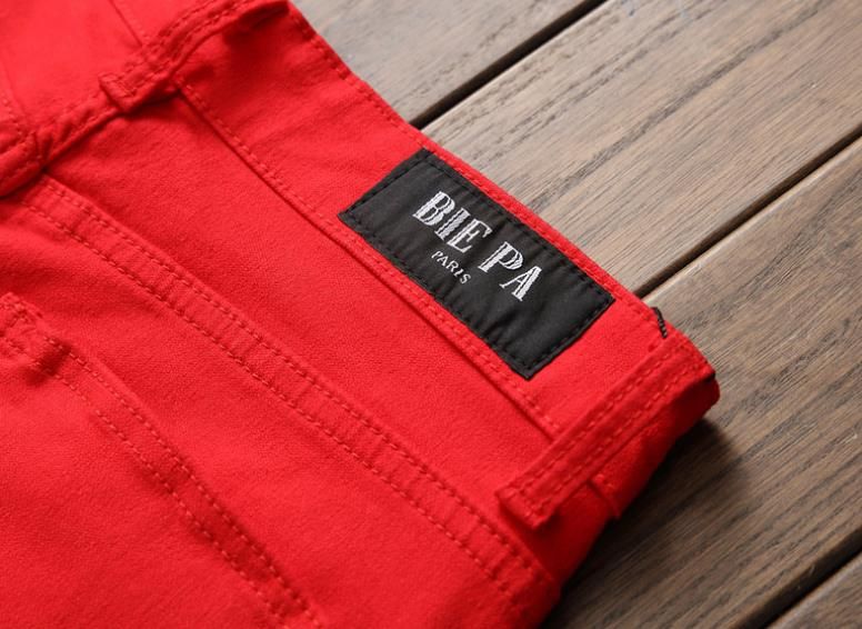 red ripped pants