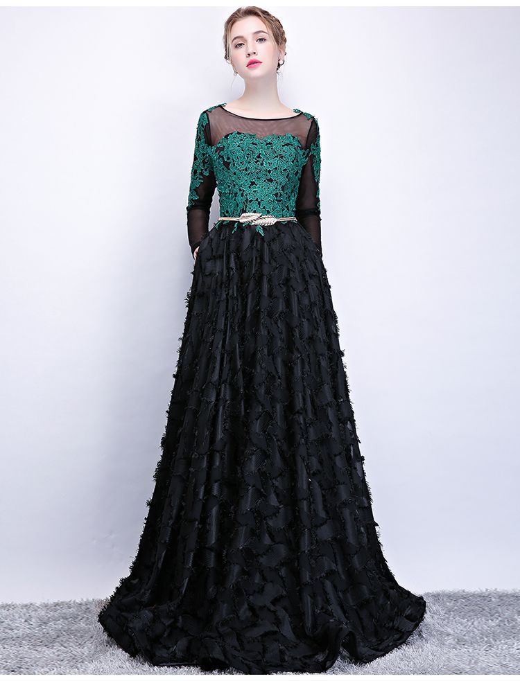 black dress with emerald green accessories