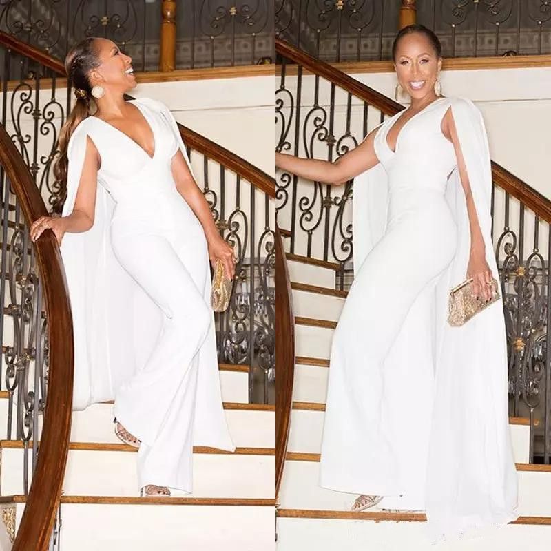 white pants suit with cape