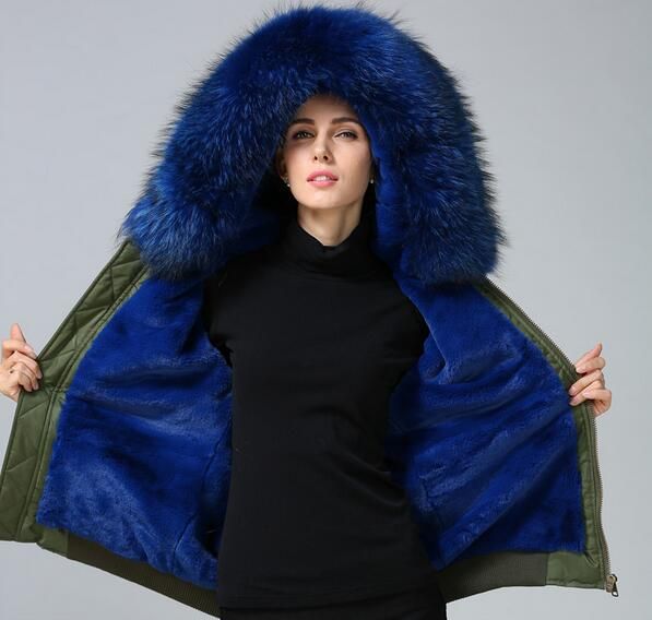 green parka with blue fur hood