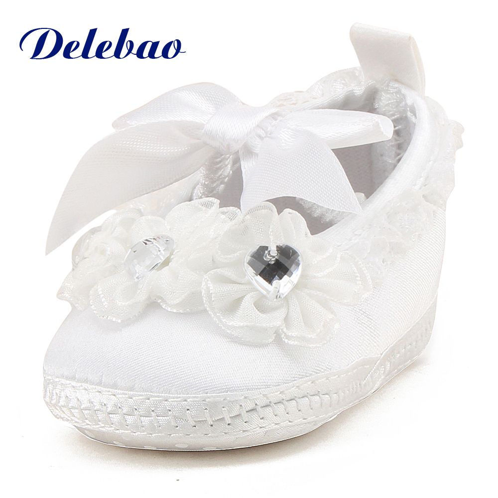 white newborn baby shoes