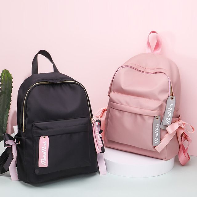 black and pink backpacks