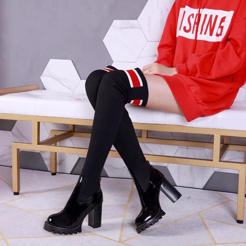 women wearing thigh high leather boots