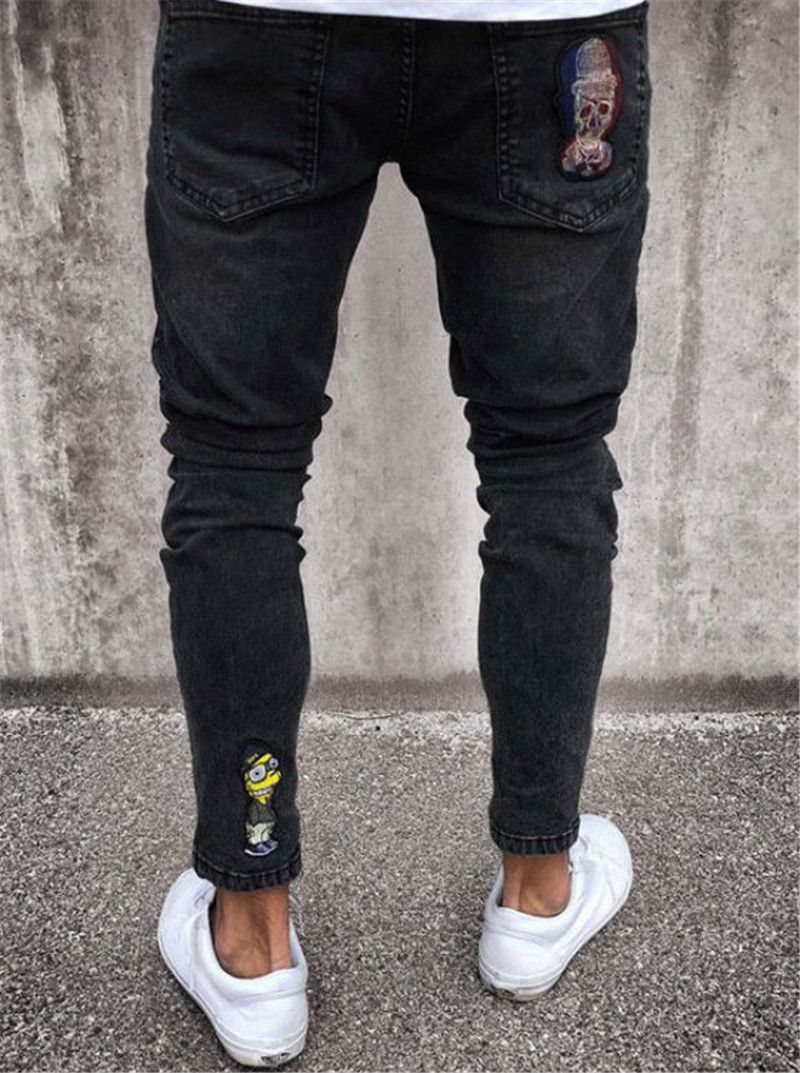 Pantalones vaqueros de los hombres de moda Elástico Ripped Skinny Biker  Jeans Patrón de dibujos animados