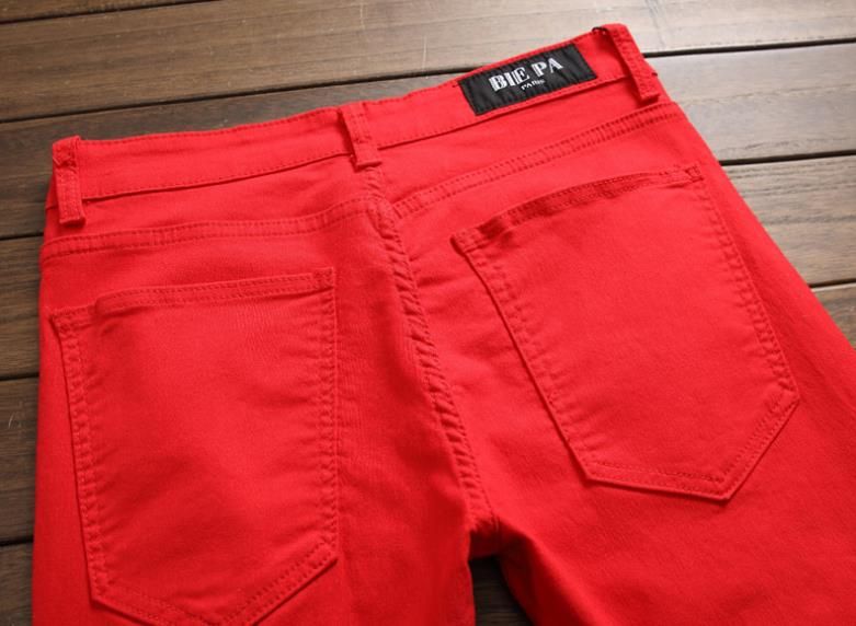 red ripped pants