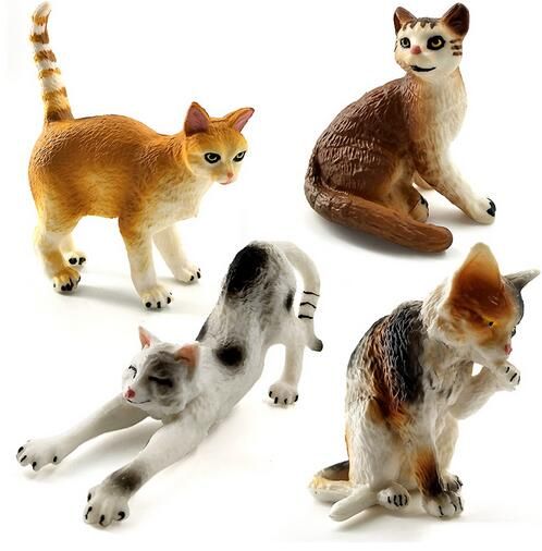 small plastic toy cats