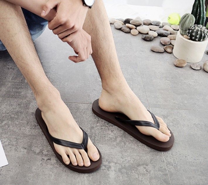 male feet in flip flops