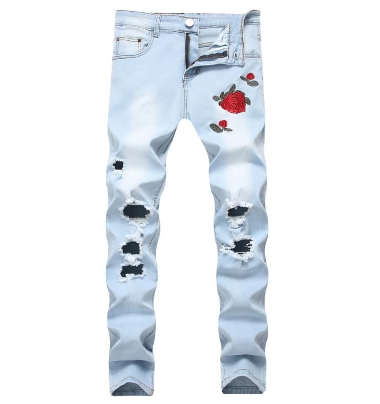 blue jeans with black patches