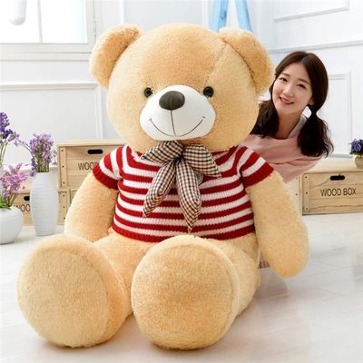 girl hugging stuffed animal