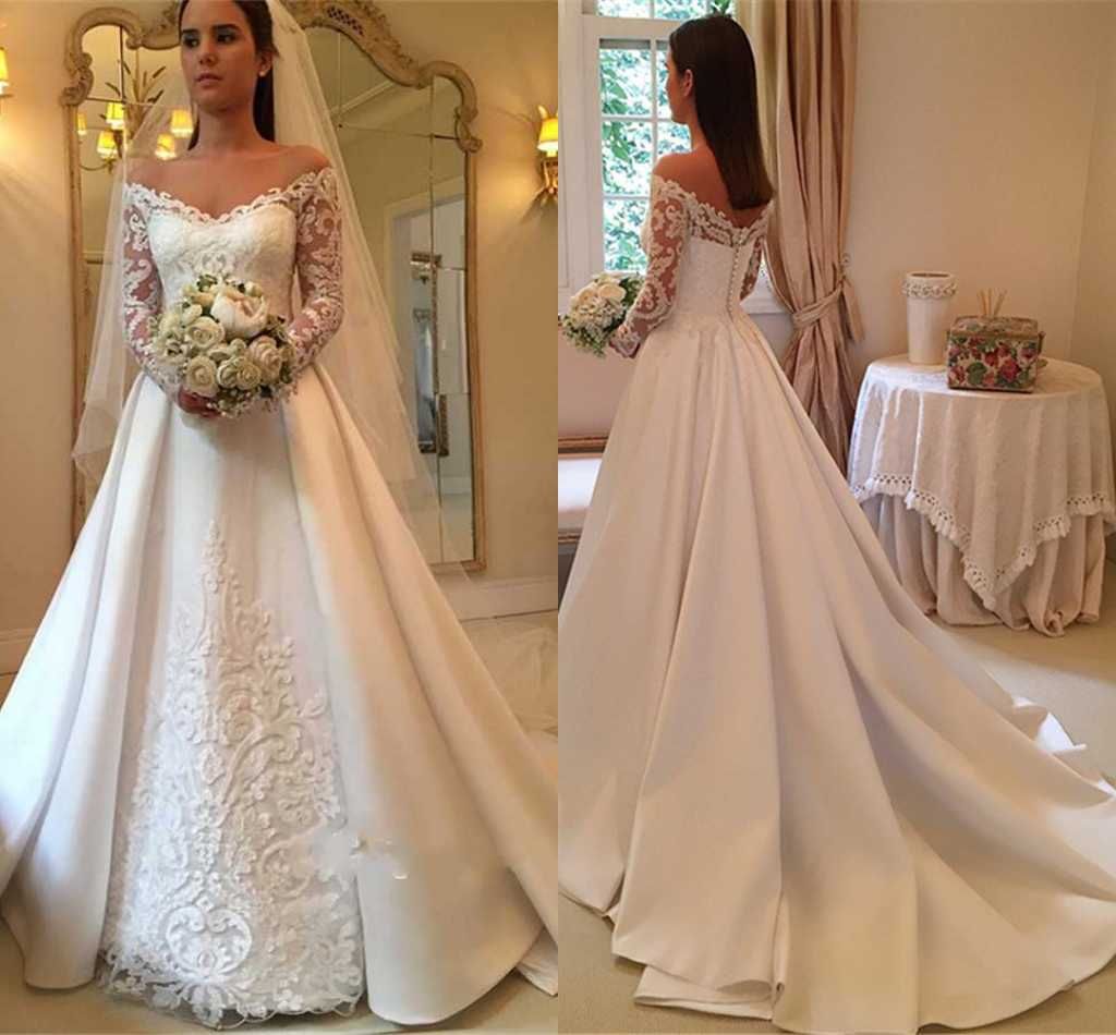 off shoulder long sleeve wedding gown