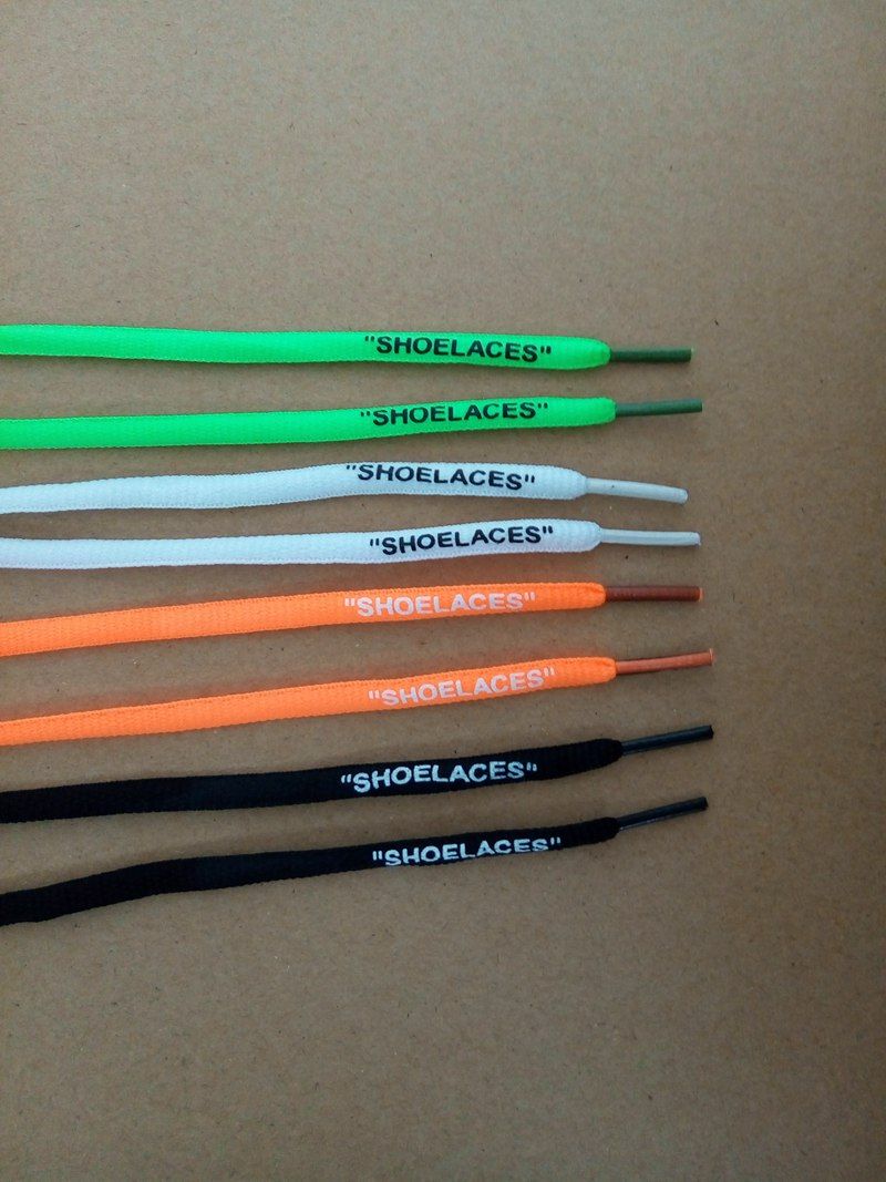 green and orange shoelaces