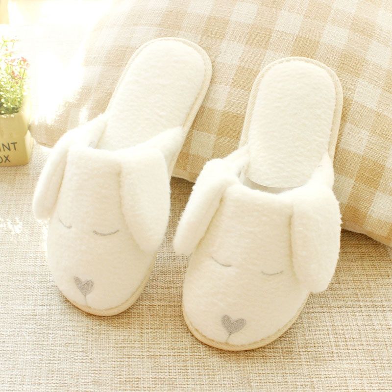 white dog slippers