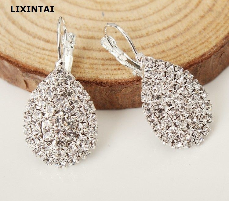 2020 Lixintai Brand Fine Jewelry Earrings Made With Swarovski Crystal Women Jewelry Inlaid White Austria Crystal Glittering Fashion Ear Studs From Liruoyu 0 81 Dhgate Com