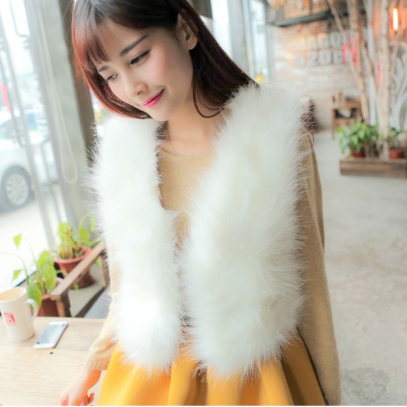 white feather vest