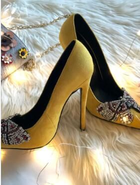 yellow and black pumps