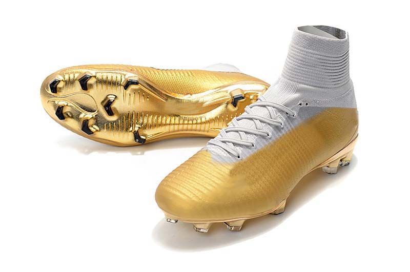black and gold kids football boots