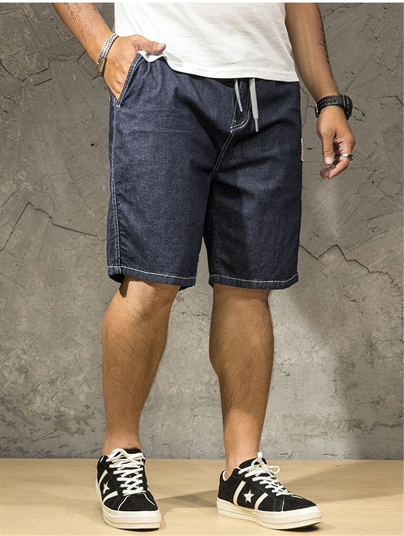 Pantalones cortos para hombre Casual cordón moda hombre Jeans Plus tamaño hombres Jeans sueltos diseñador