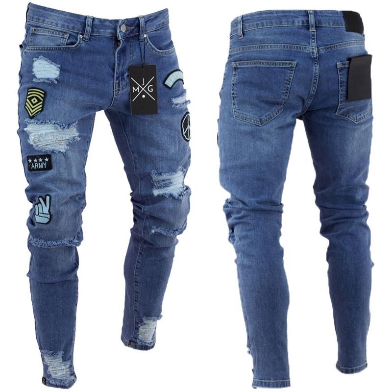 Compra Estilo Americano Europeo Retro 2018 De La Moda Los Pantalones  Vaqueros Del Agujero De La Rodilla Del Pie Pequeño Nuevos Hombres Elásticos  De Los Pantalones Vaqueros De Dibujos Animados Patch Vaqueros