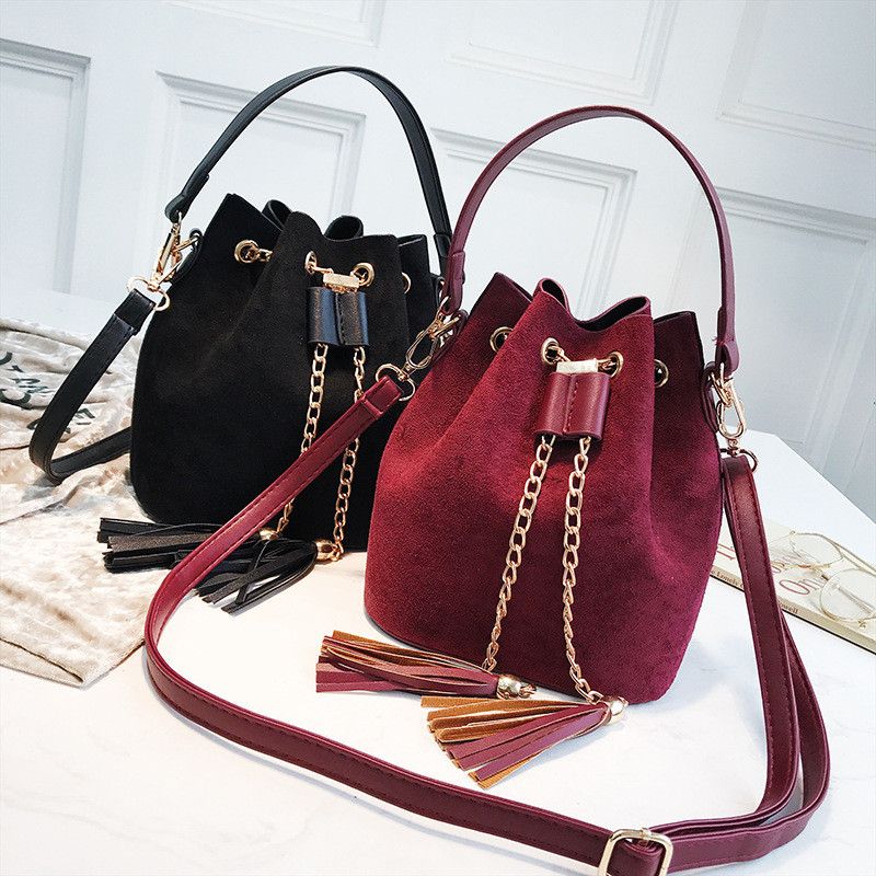 leather bucket bag with tassels