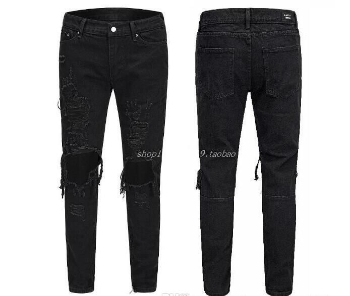 black pants with holes in them