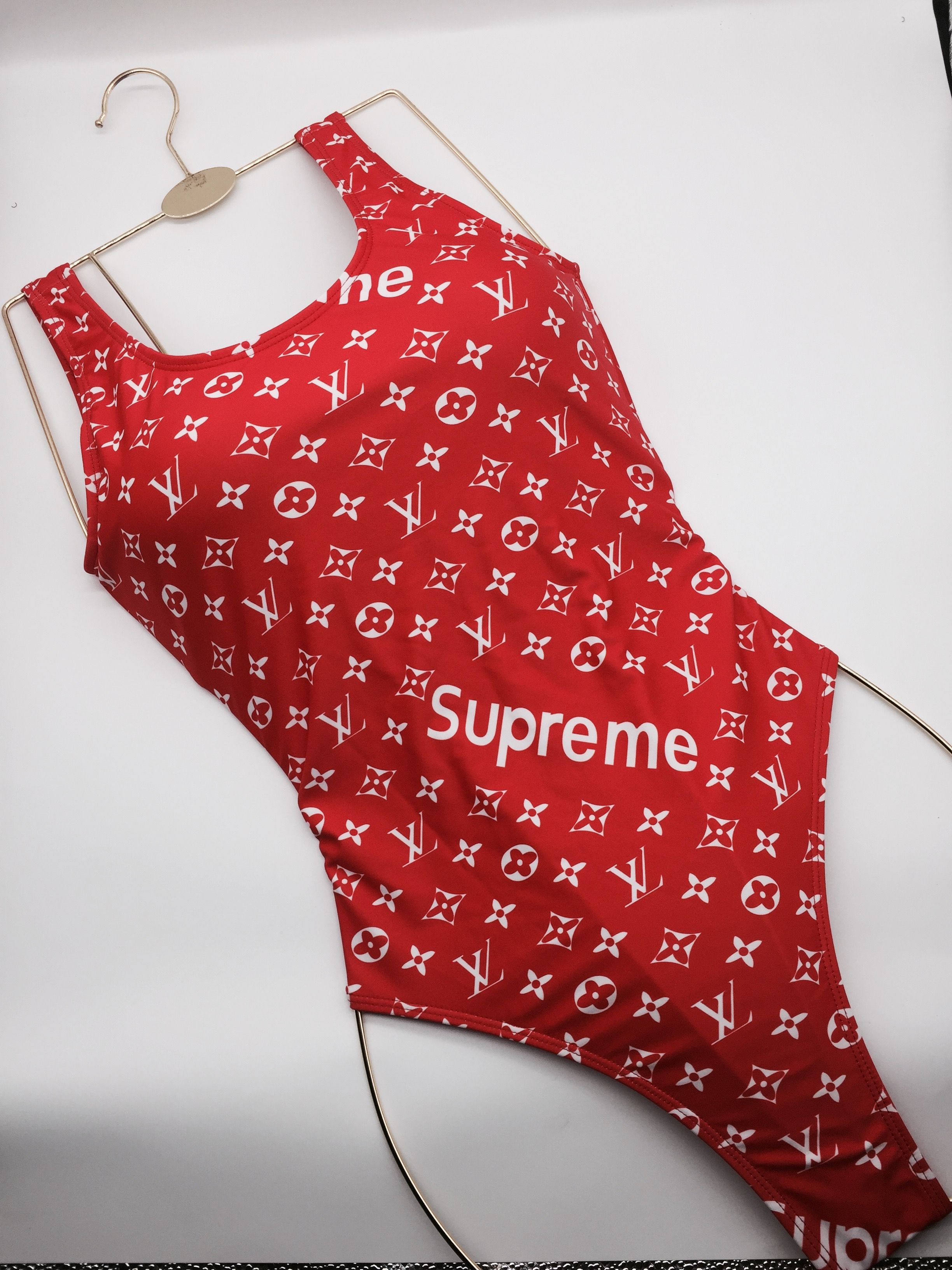 bathing suit brand with x logo