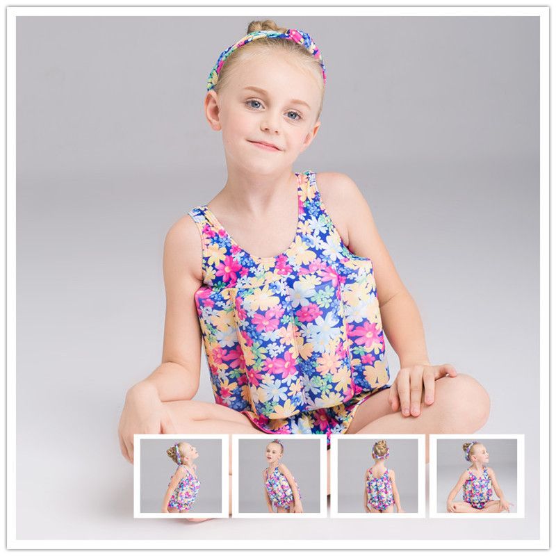 boy in girl's one piece swimsuit